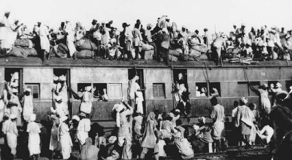 Hundreds of Muslim refugees crowd atop a train leaving New Delhi for Pakistan on the day when British India was divided up into officially Muslim Pakistan and mostly Hindu India, September, 1947